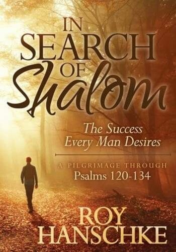 A man walking down country road with tree limbs bare and fallen dead leaves on the ground in Search of Shalom.