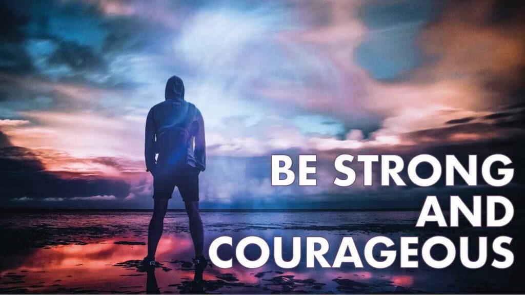A man standing looking at barren and bleak land and thinking I must Be Strong and Courageous.