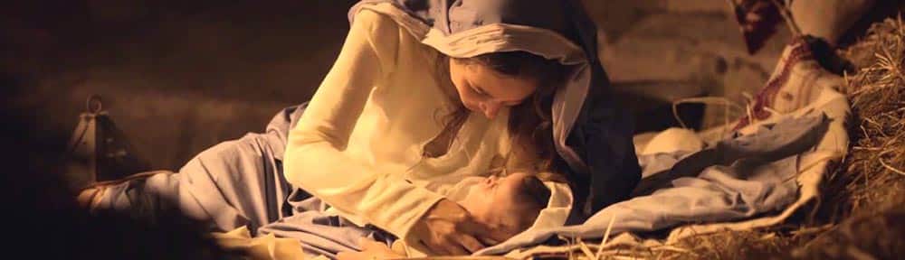 Embraced by divine light, Mary and Jesus share a sacred moment.