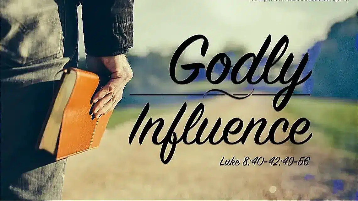 Person holding Bible, text overlay: Godly Influence, Luke 8:40-42;49-56