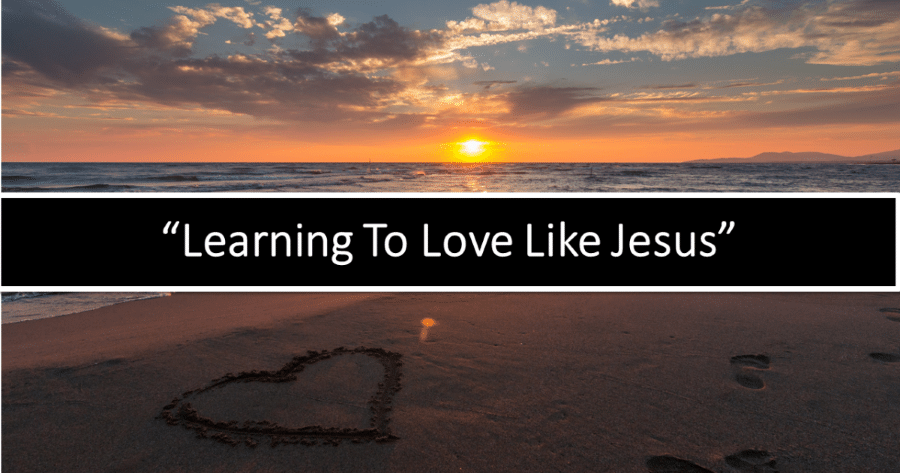 Heart drawn in the sand at sunset, with text "Learning To Love Like Jesus".
