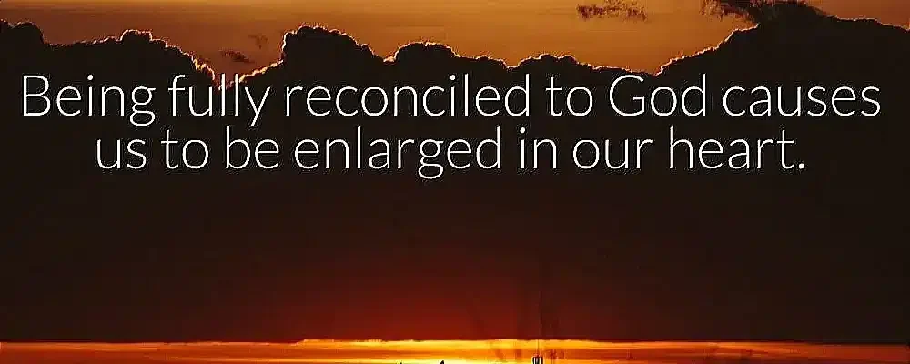 A beautiful sunset with an inspiring quote overlay that reads, "Being fully reconciled to God causes us to be enlarged in our heart," emphasizing the theme of reconciliation with God.