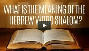 Open Bible laying on table with letters above stating What is the meaning of shalom.