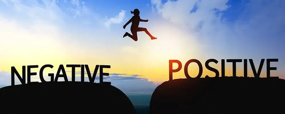 A silhouette leaps toward dawn, moving from negative to positive, embodying a sense of wholeness.