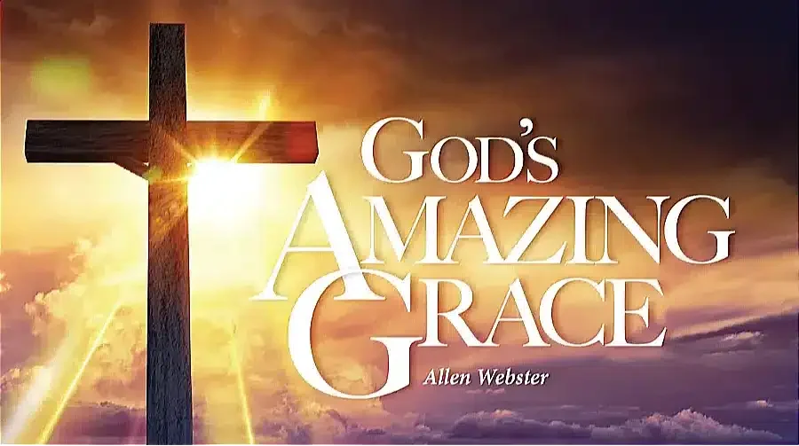 A wooden cross silhouetted against a vibrant sunset sky with glowing clouds, symbolizing the beauty of God's grace, accompanied by the text "God’s Amazing Grace" by Allen Webster.
